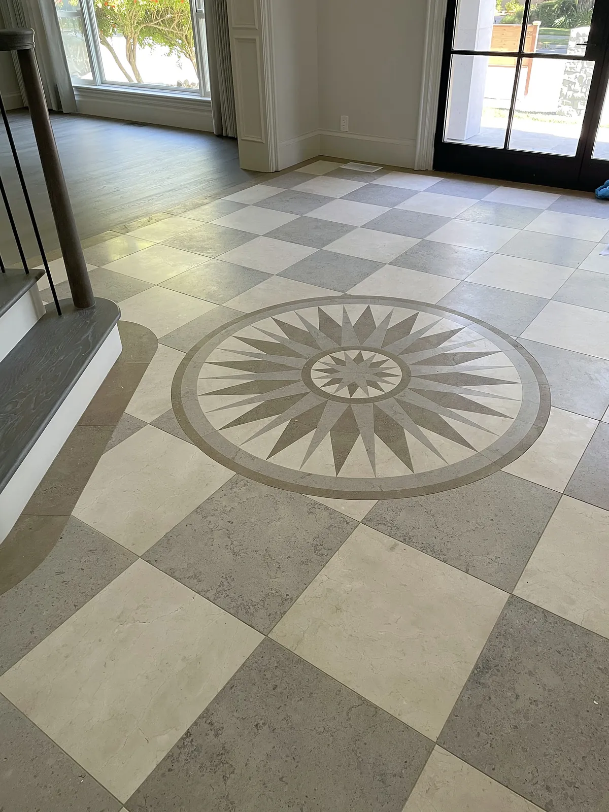 Compass-rose stone inlay in a checkerboard floor